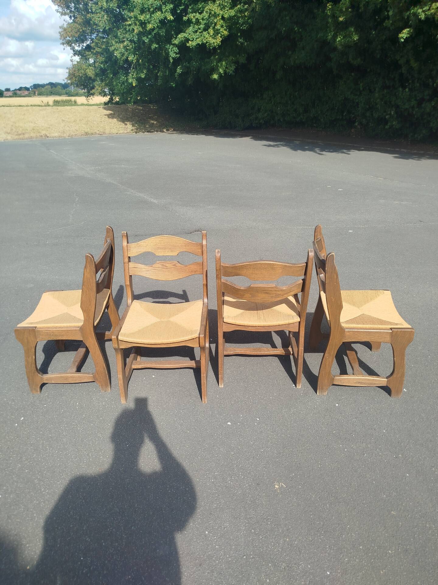 Set of 4 solid oak chairs with straw, in the style of Guillerm.