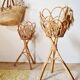 Pair of vintage rattan "Diabolo" plant stands from the 1960s.