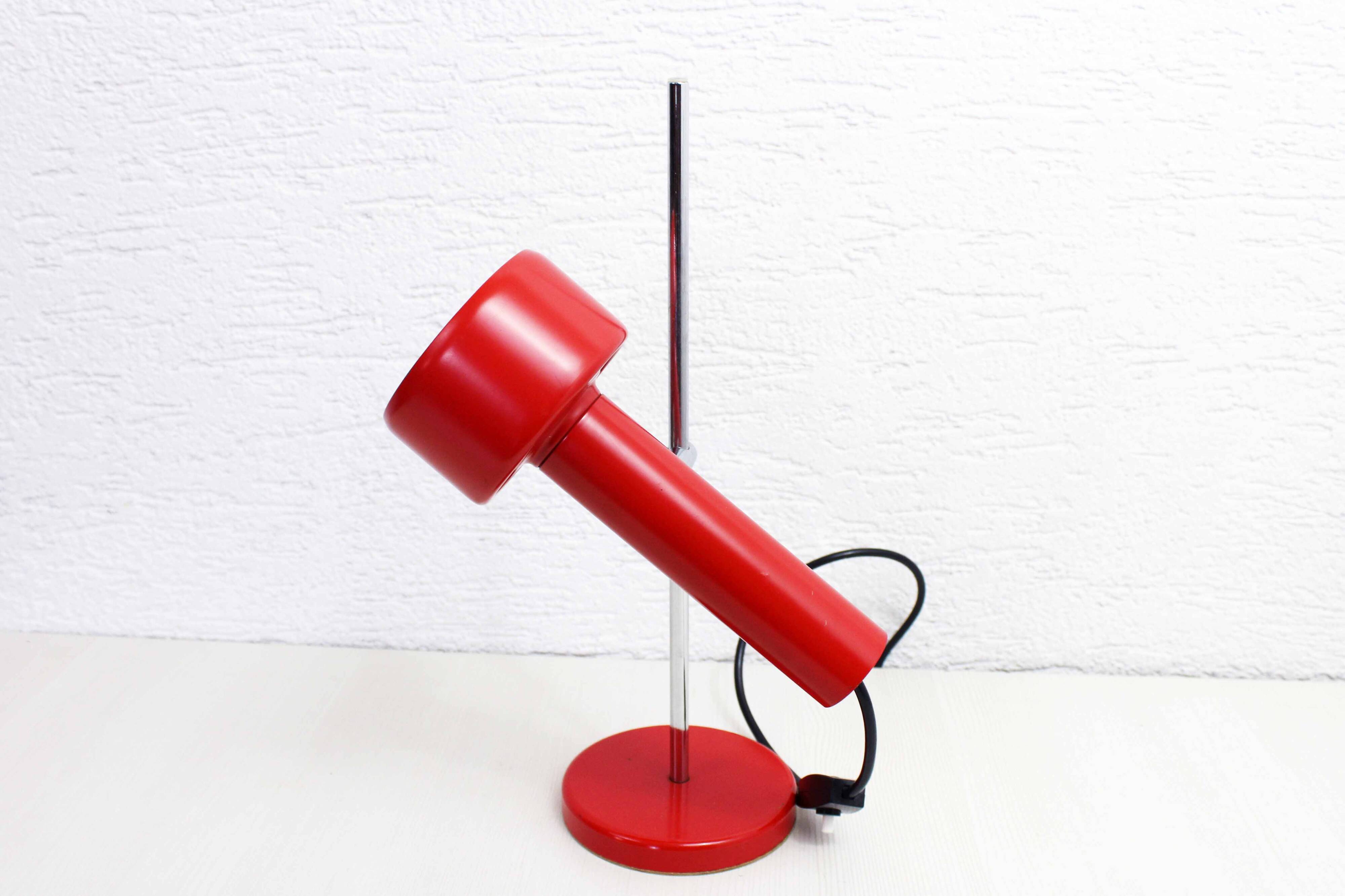 Red metal articulated desk lamp