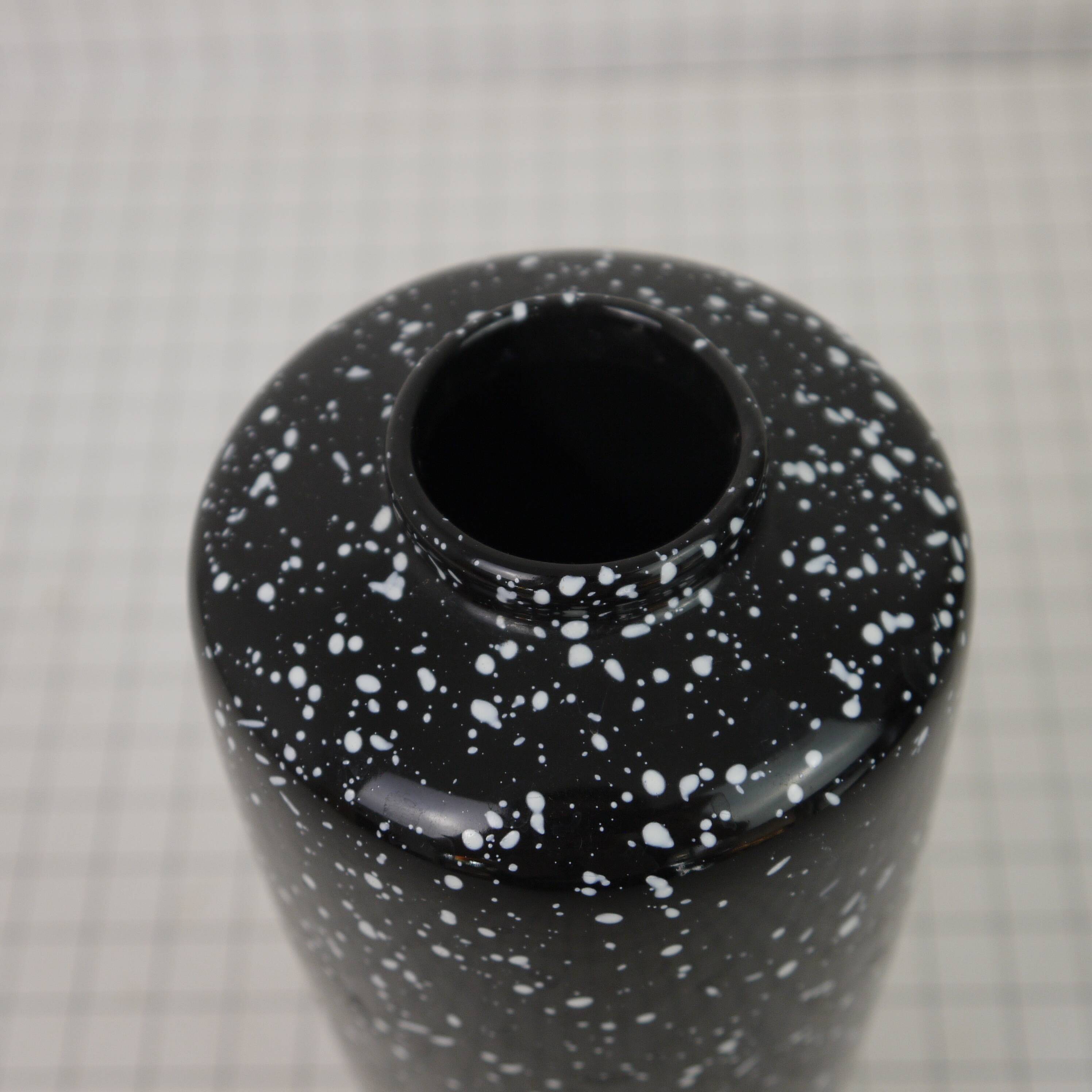 Black and white speckled vase