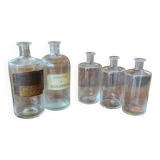 Series of 5 blown glass apothecary pharmacy bottles