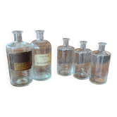 Series of 5 blown glass apothecary pharmacy bottles