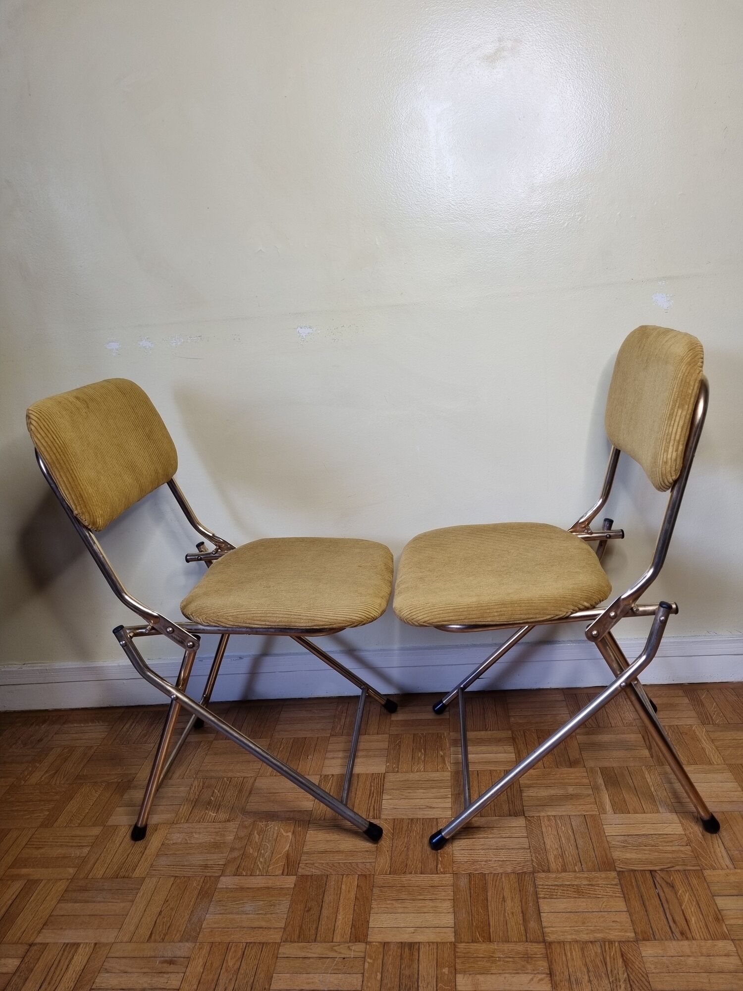 Pair of vintage folding chairs in gilded metal and 70s fabrics, restored