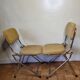 Pair of vintage folding chairs in gilded metal and 70s fabrics, restored