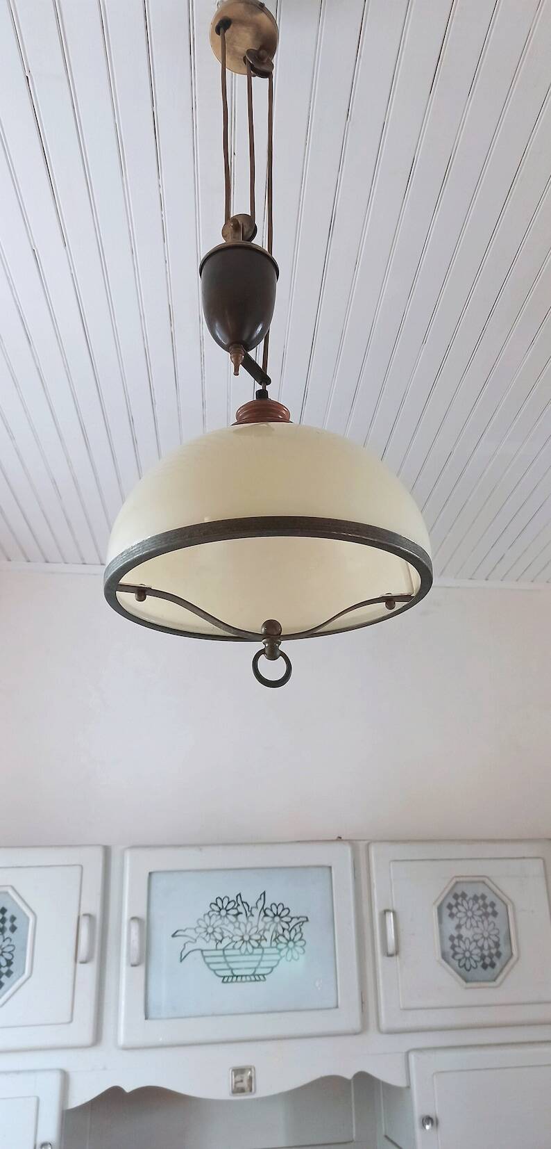 Old large pulley chandelier in brass and glass