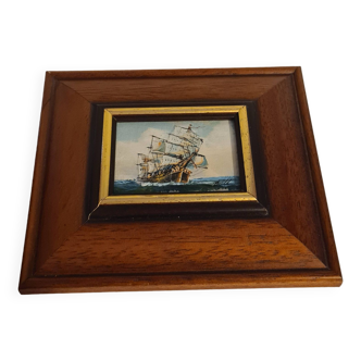 Wooden frame with boat decor