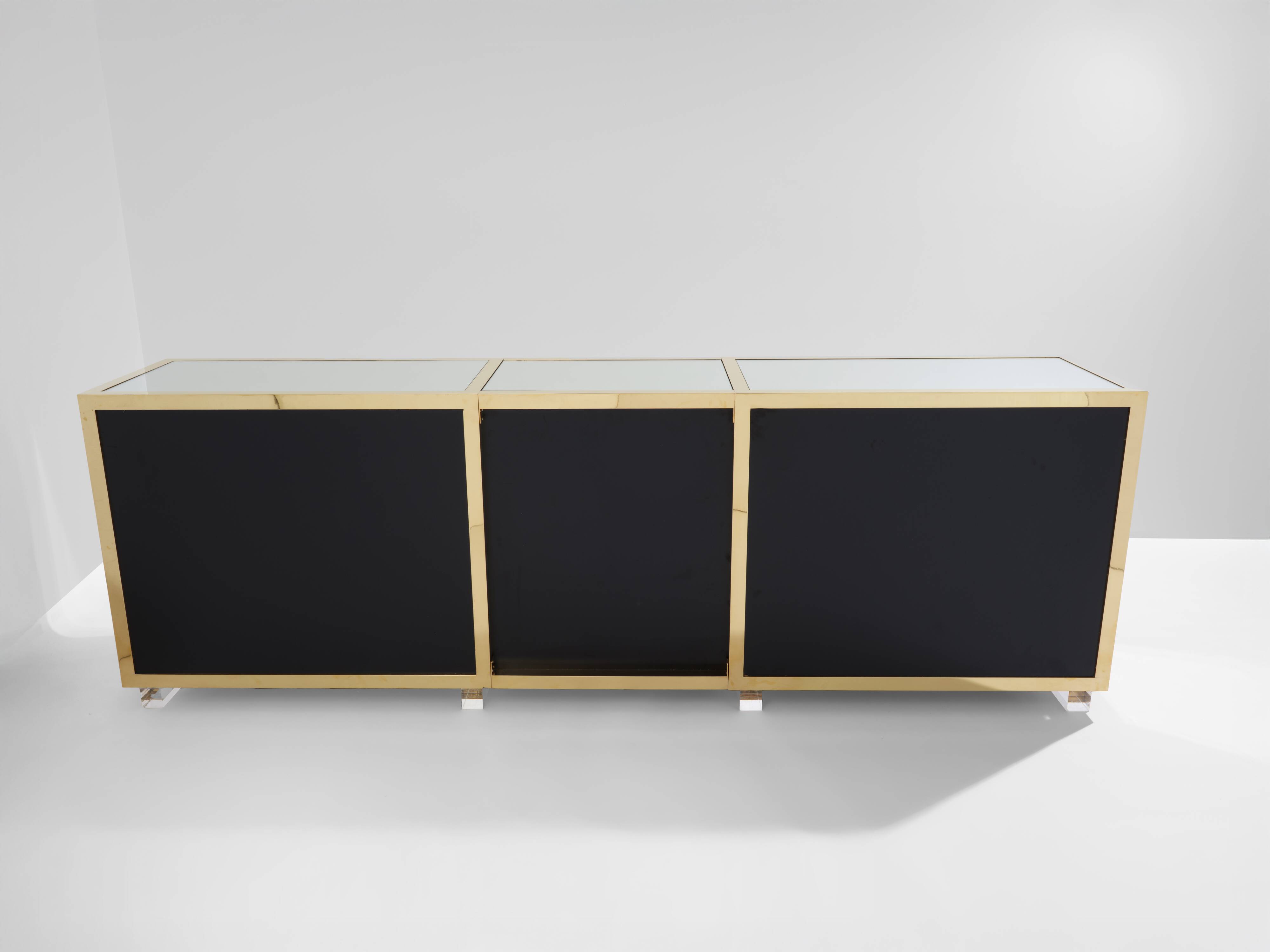 Brass sideboard with mirror and plexiglass legs by Michel Pigneres, 1970
