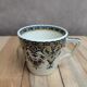 Antique ironstone cup from Sarreguemines with polychrome decoration.
