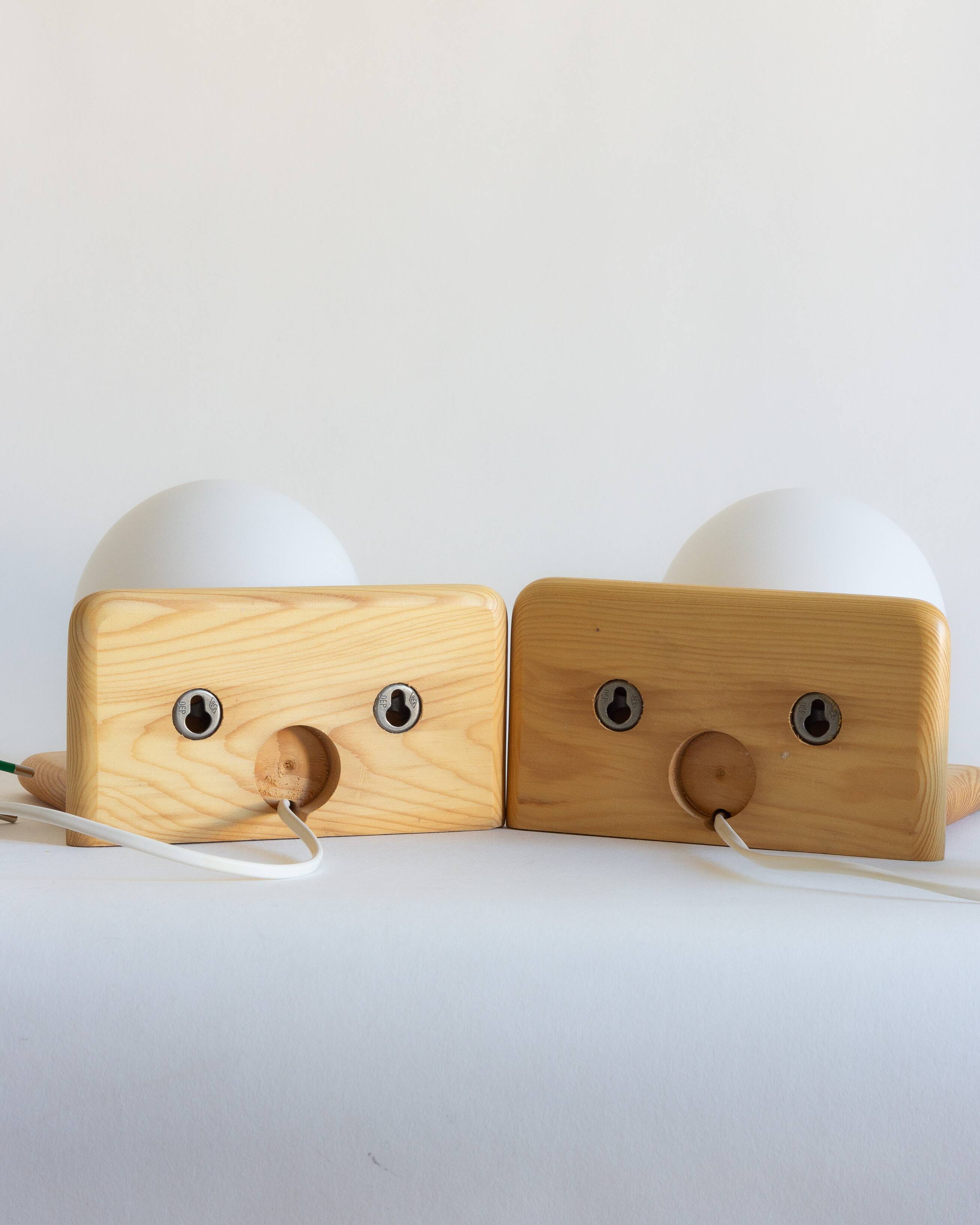 Duo of pine and opaline glass wall lights, 1980s