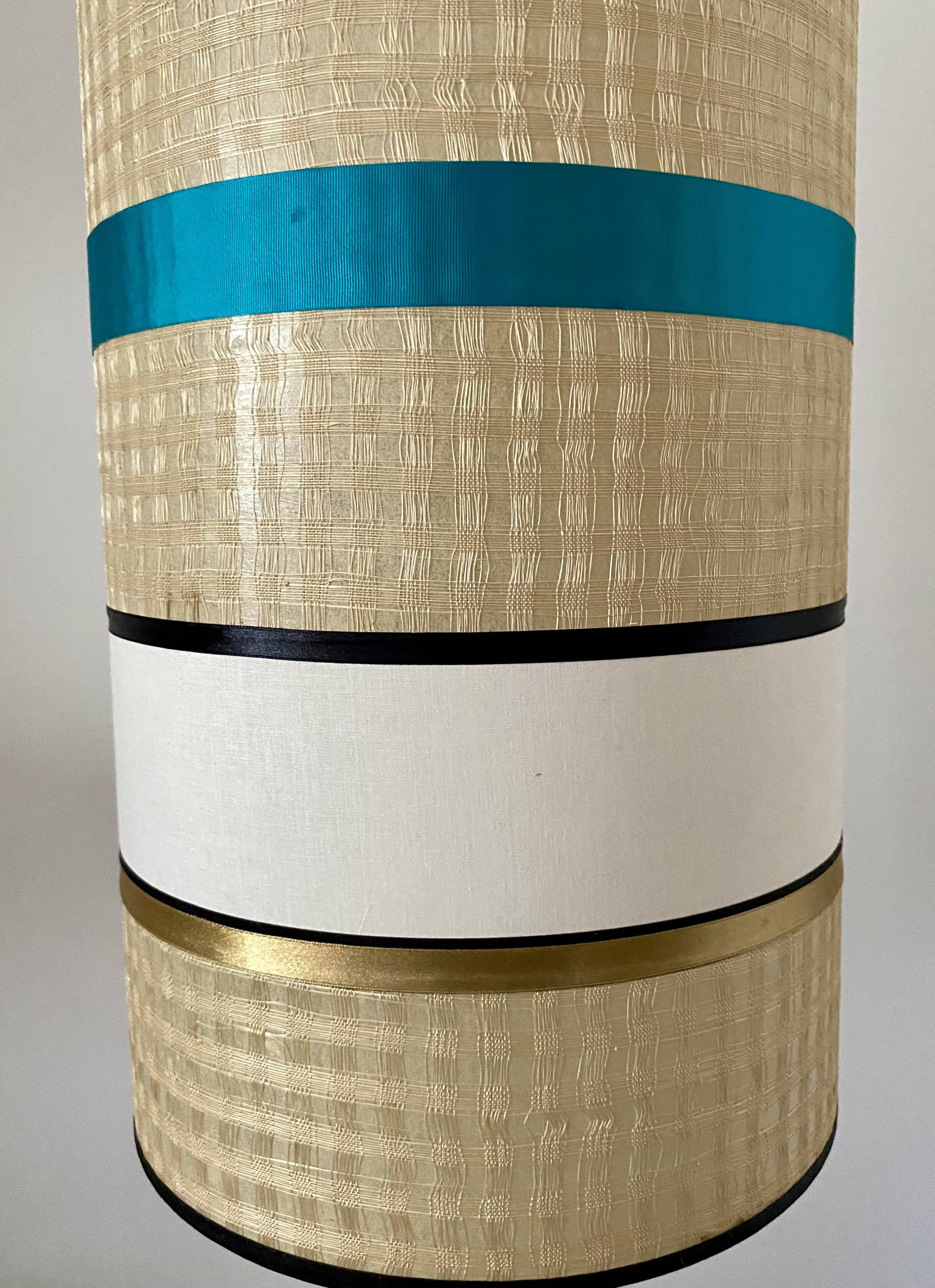 Solid oak floor lamp with a designer shade