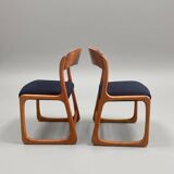 Pair of vintage Baumann sled chairs with curved wood in honey colour.