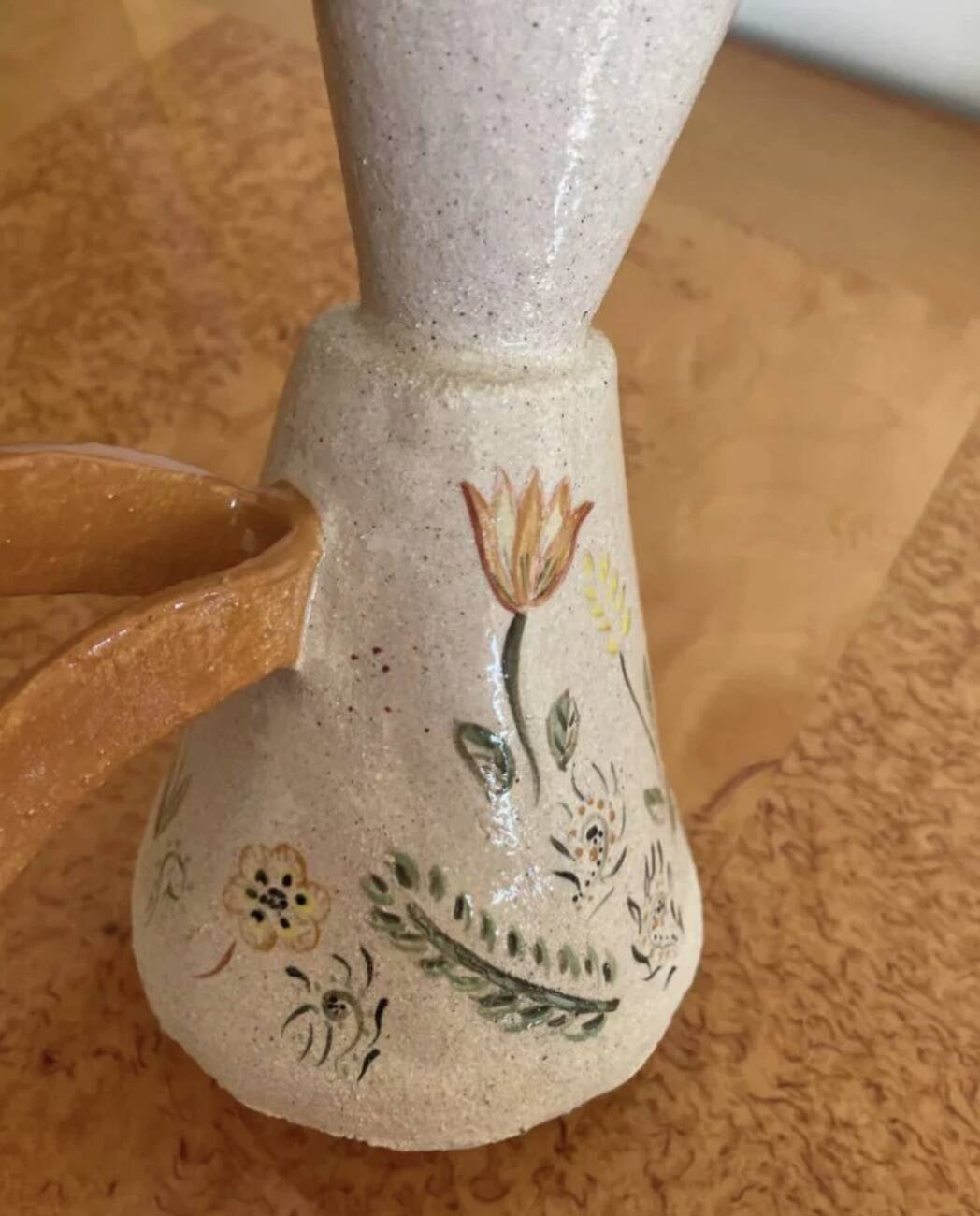 Handcrafted pitcher with floral motif
