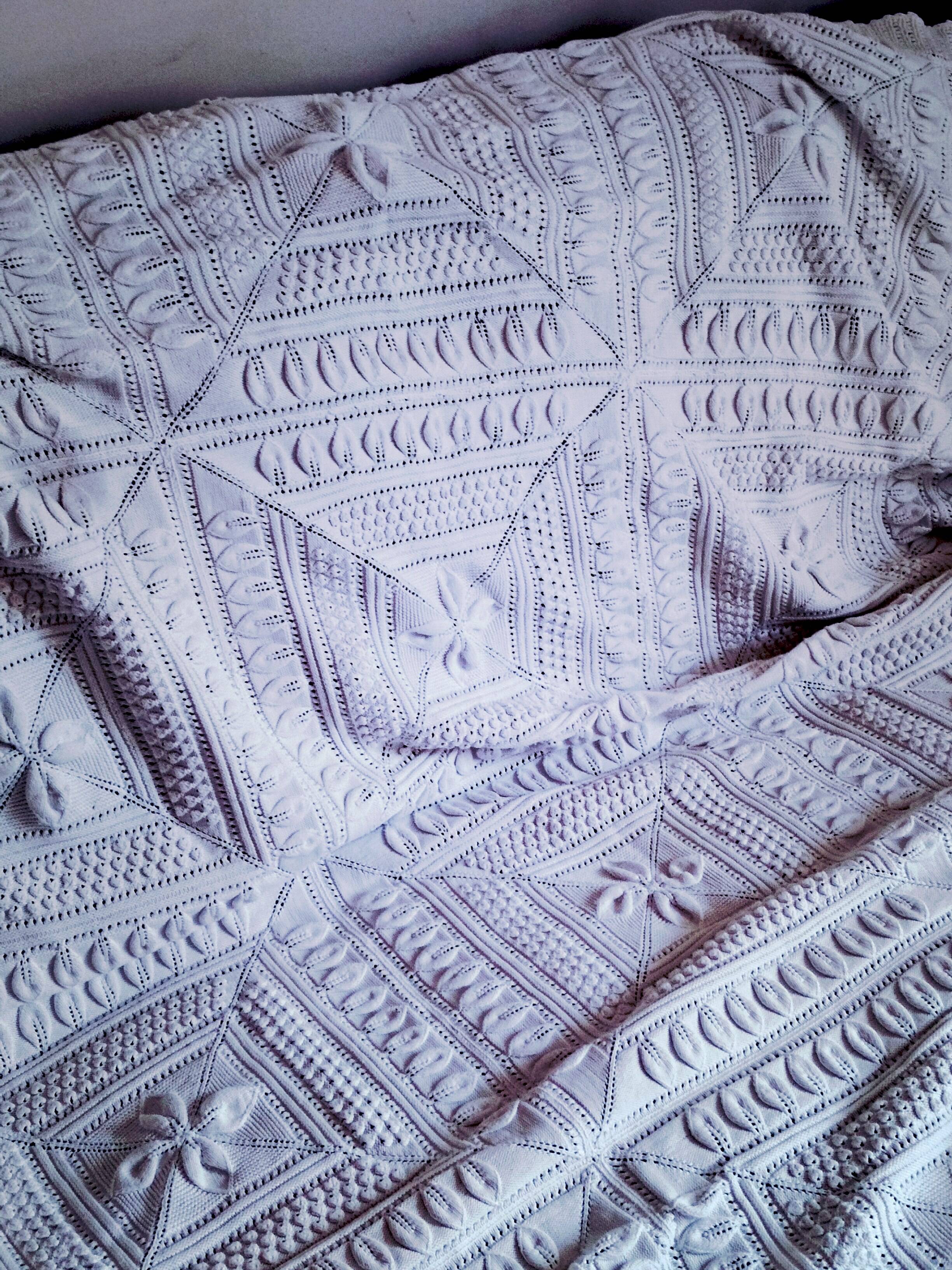 Knitted white cotton bedspread