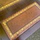 Victorian English extendable coffee table made of solid mahogany and leather.