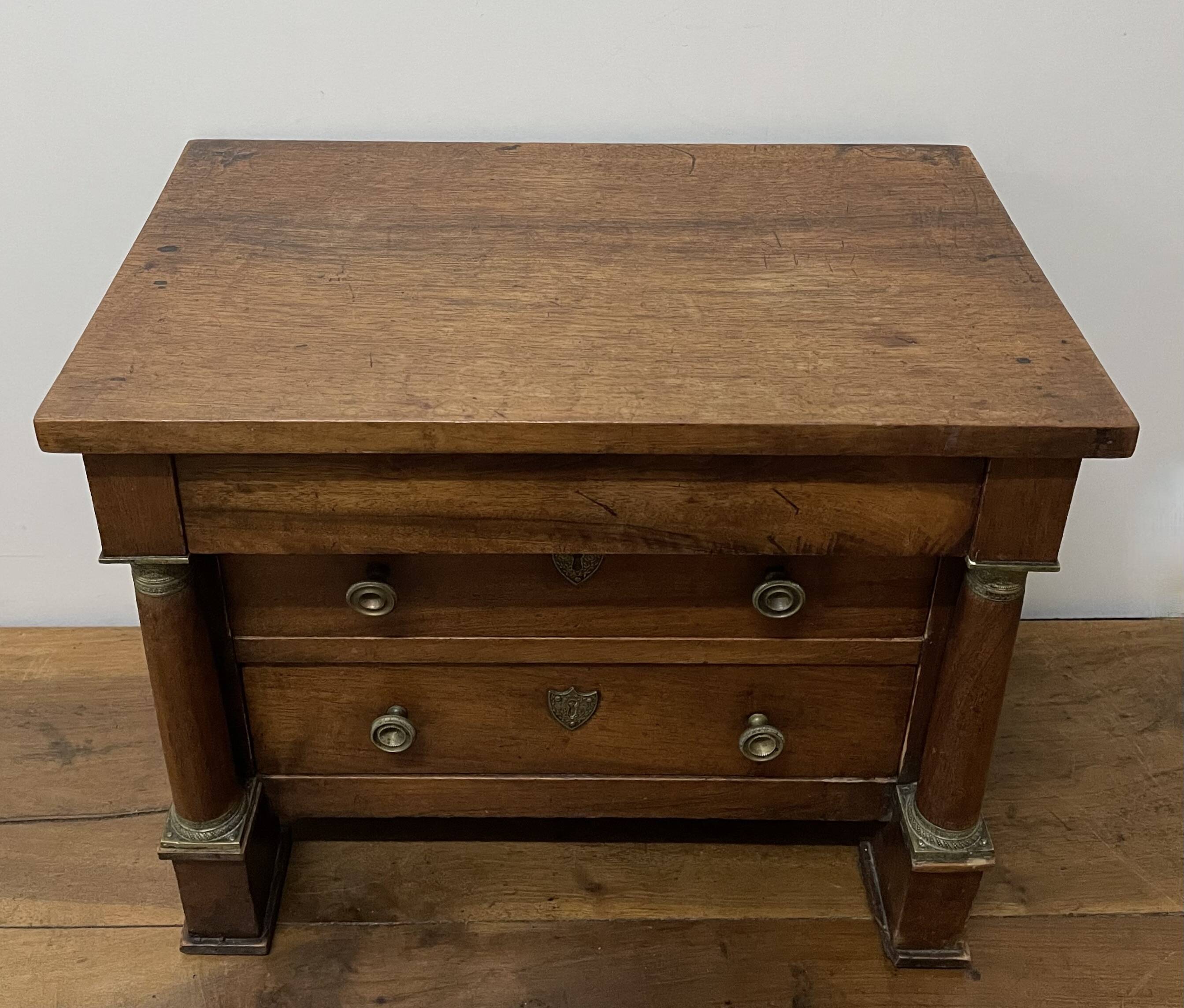 19th century Empire style walnut chest of drawers. It opens with 3 drawers in
