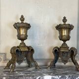Pair of Louis XIV style andirons in bronze after a design by André-Charles Boulle.