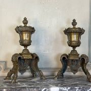 Pair of Louis XIV style andirons in bronze after a design by André-Charles Boulle.