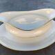 Vintage fine porcelain sauce boat with gold gilding.