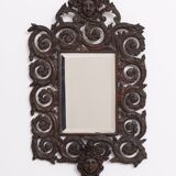 Miroir mural antique en bronze coulé représentant une tête de femme