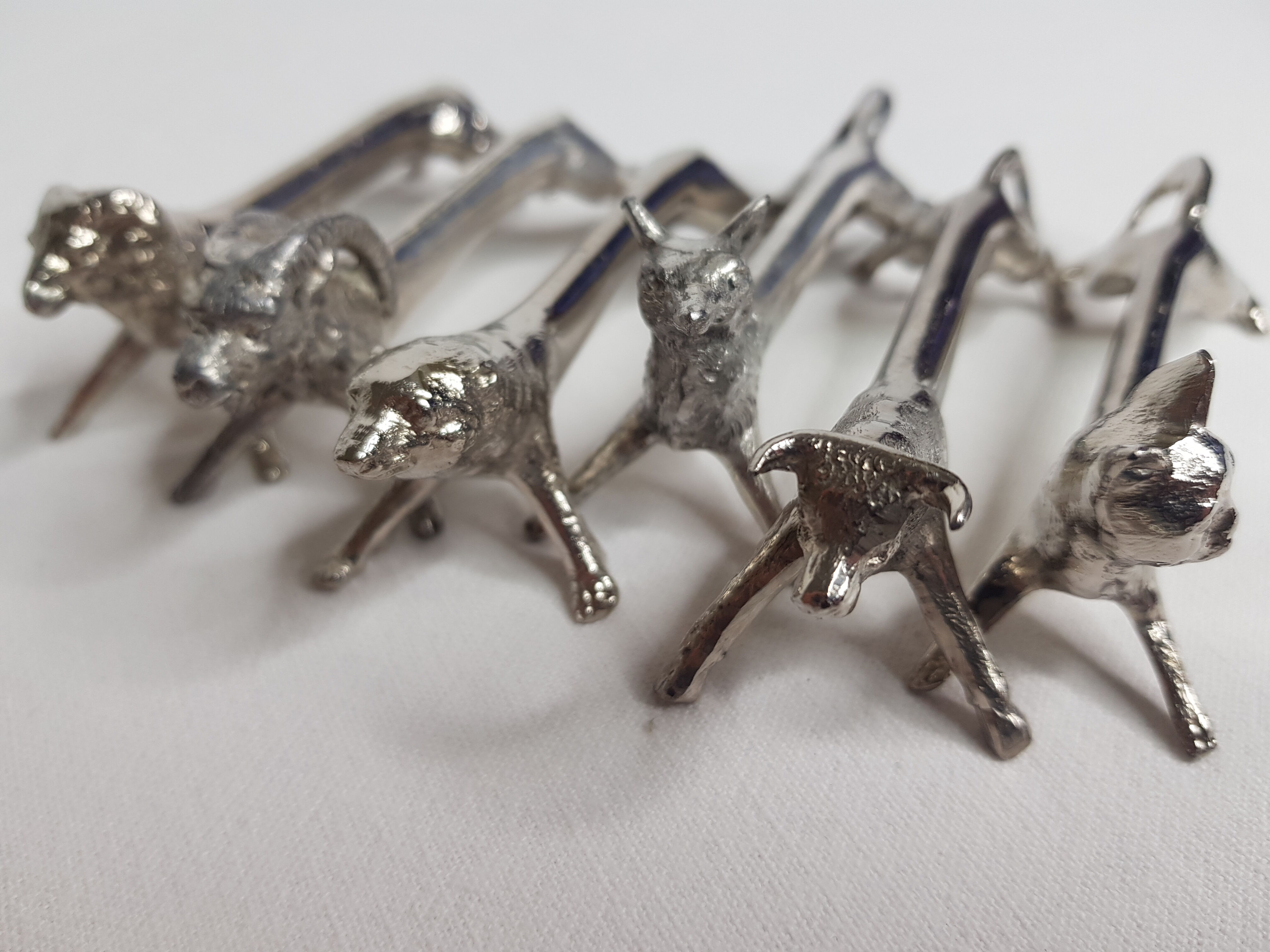 Six old animal knife holders in chrome metal