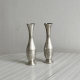 2 shiny metal vases