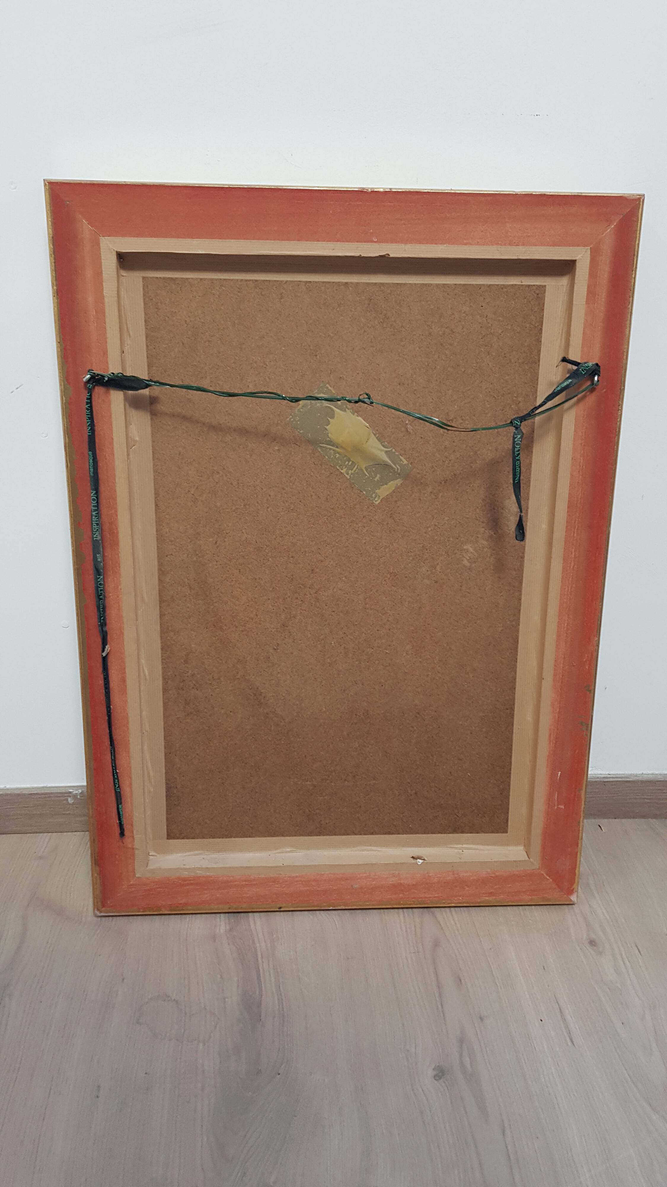 Mirror in gilded stucco wood and beveled glass