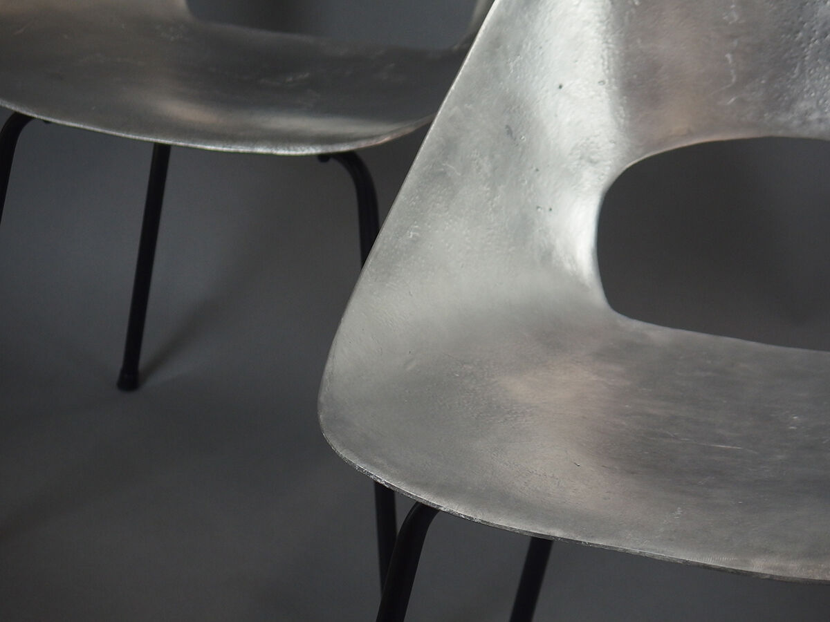 Four aluminium chairs by Pierre Guariche