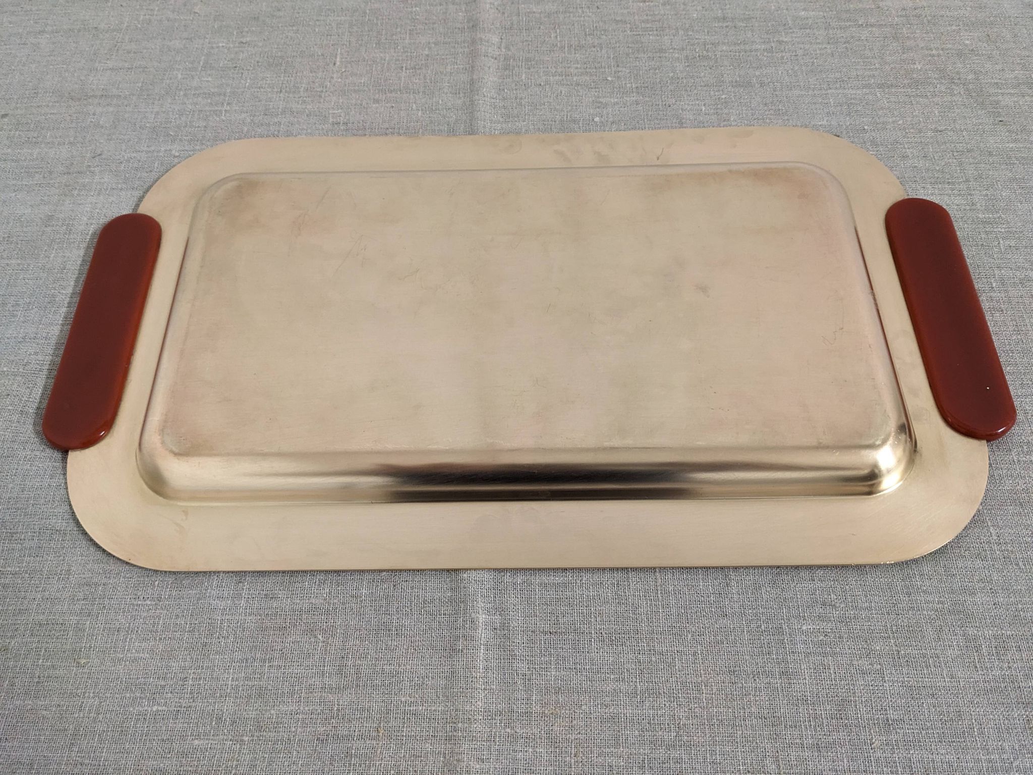 Plates and a brass and Bakelite cut by PM Italy, Italy around 1970.