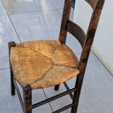 4 mismatched wood and straw chairs