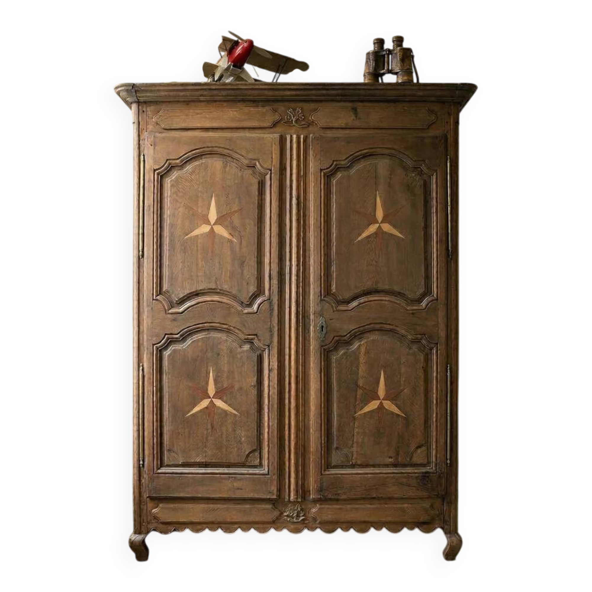 Antique French rustic wardrobe with star inlays.