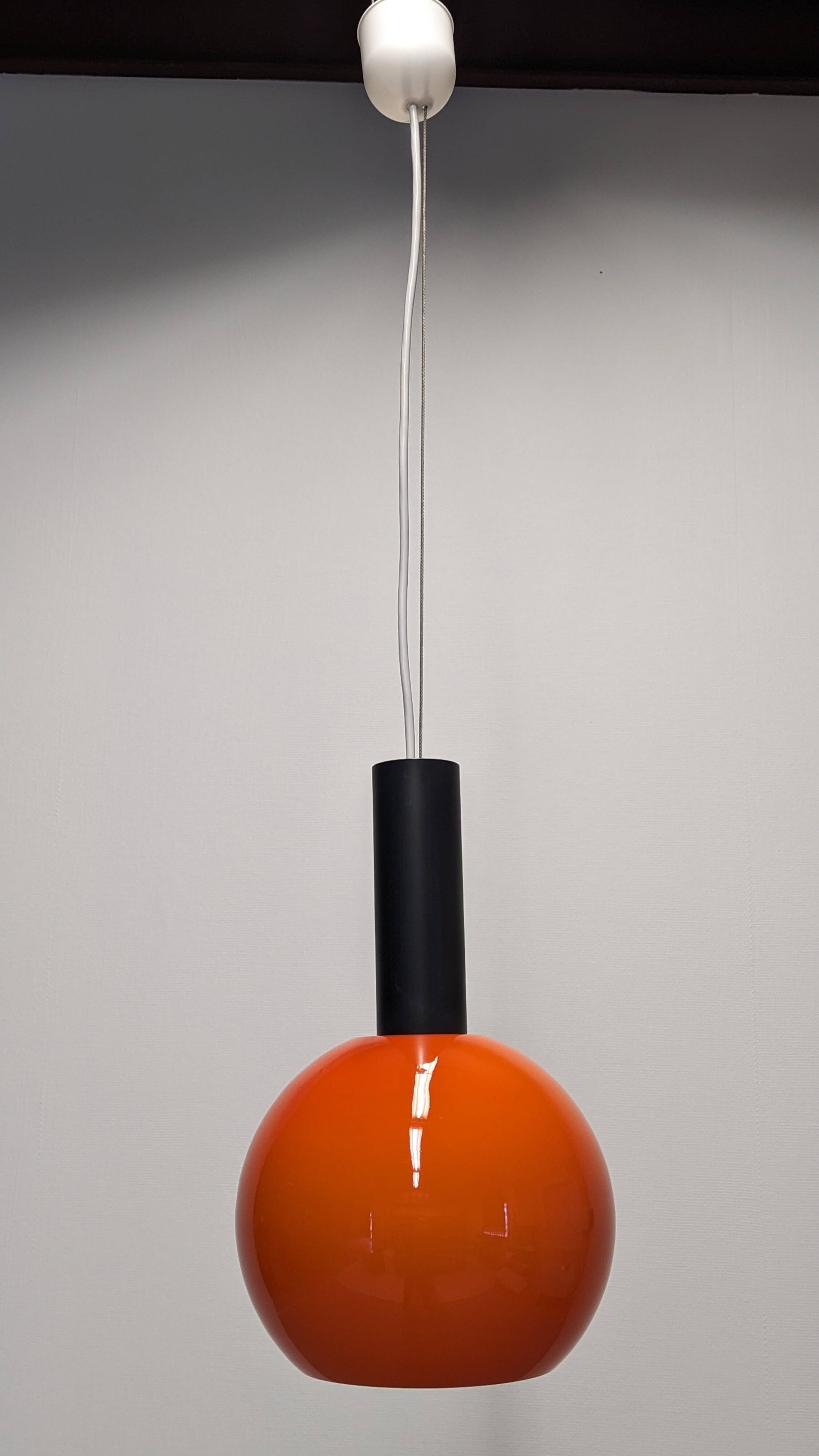 Pair of orange opaline ball pendants by Parscot, France circa 1970.