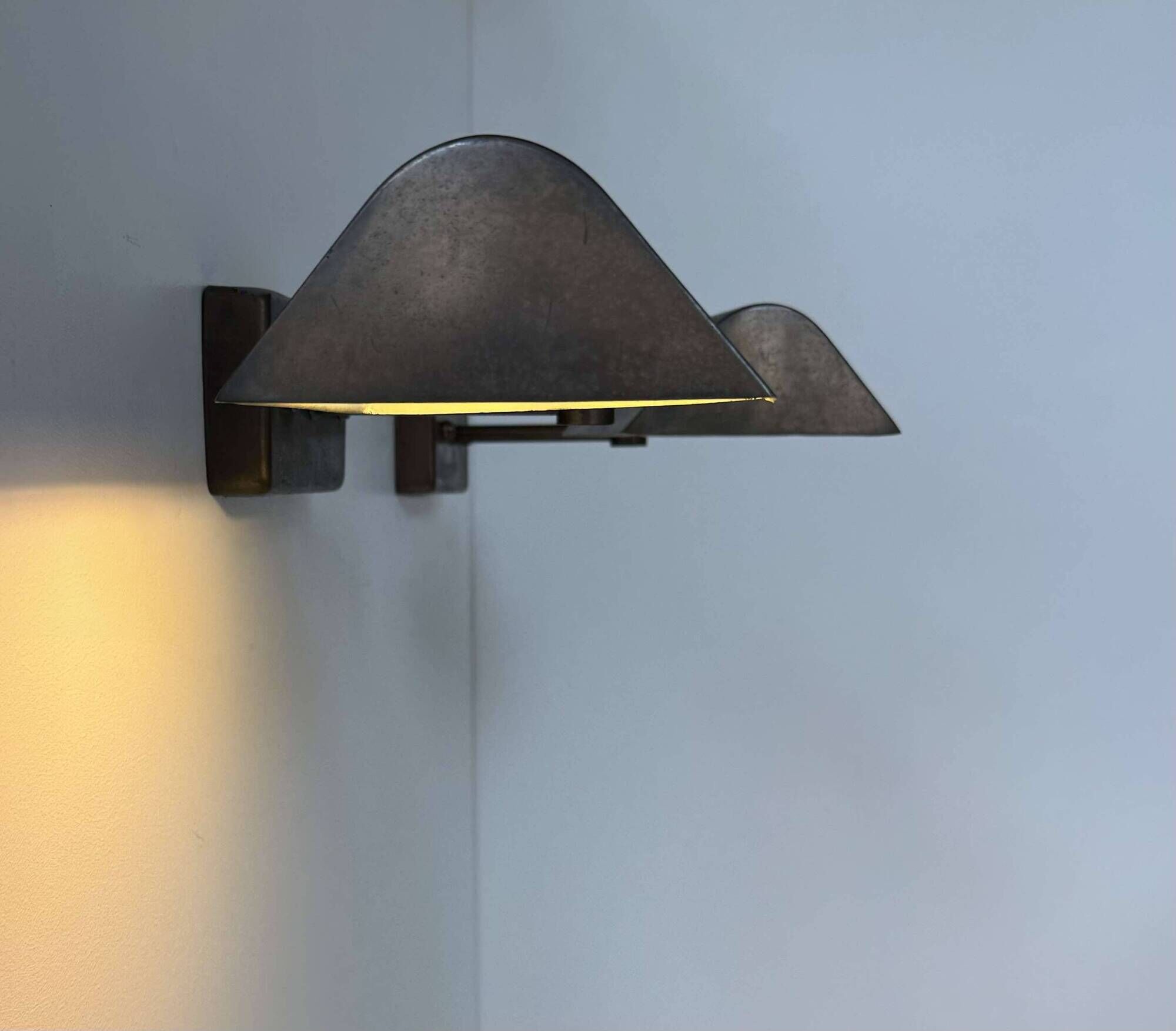 Pair of vintage adjustable wall lights, patinated brass, France 1970.