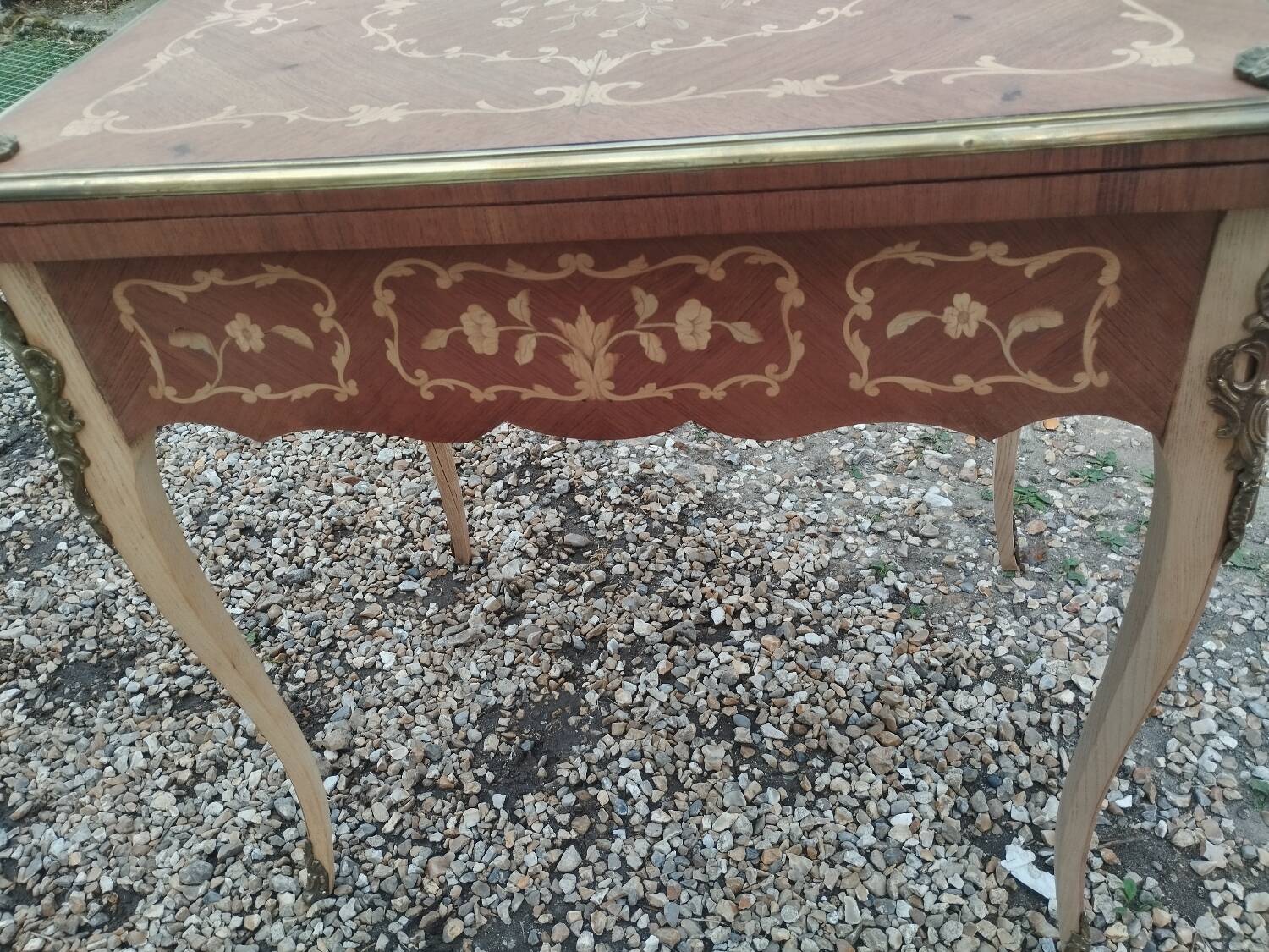Antique game table in Louis XVI style with marquetry.