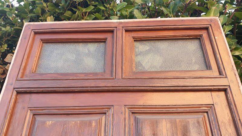 Front door and its frame, translucent glass windows, early 20th century