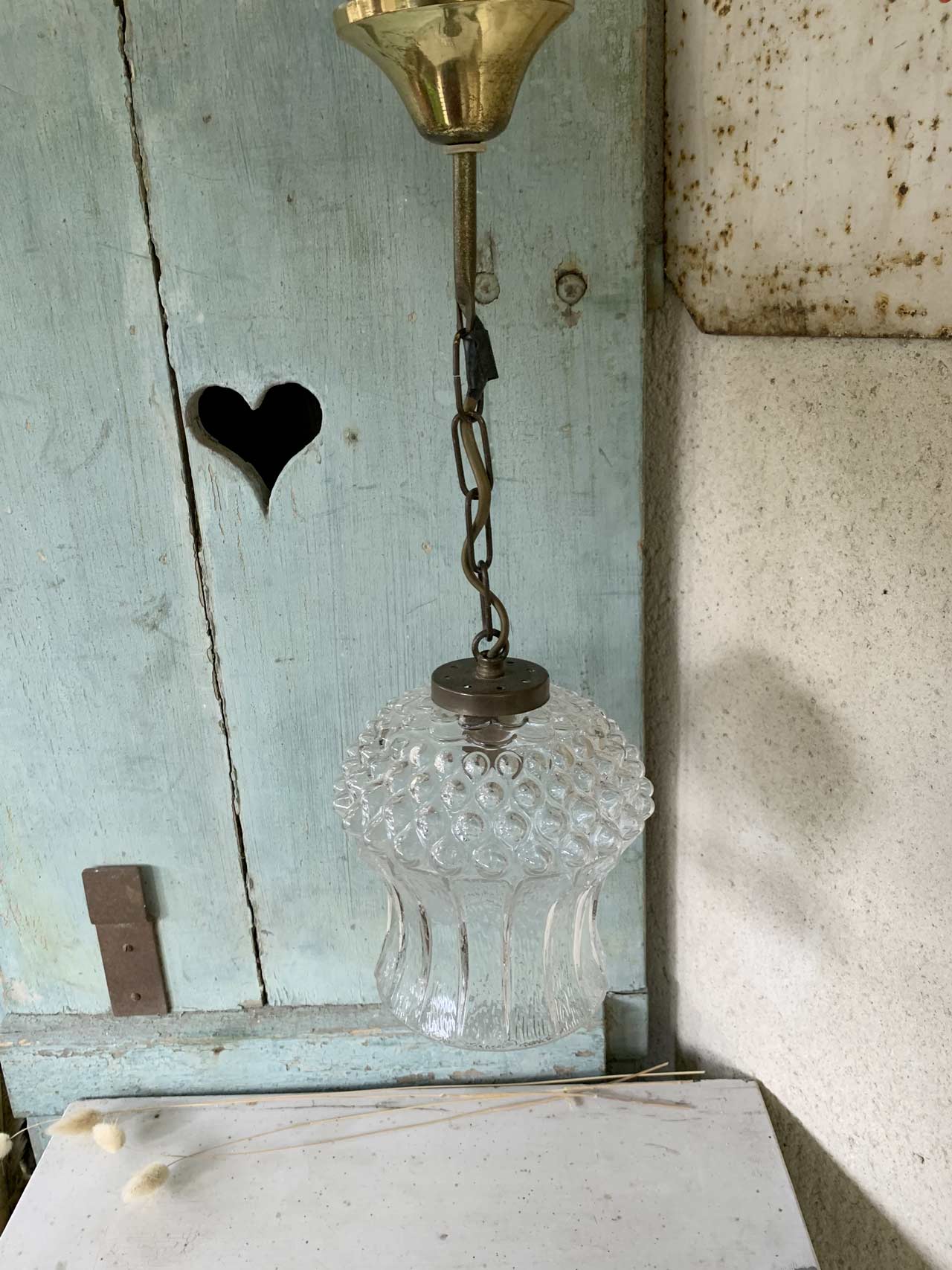 Glass and brass suspension