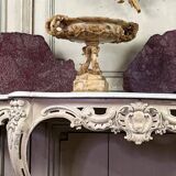 Alabaster bowl decorated with vine leaves on a base of three dolphins, circa 1880.