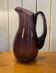 Plum colored glass pitcher