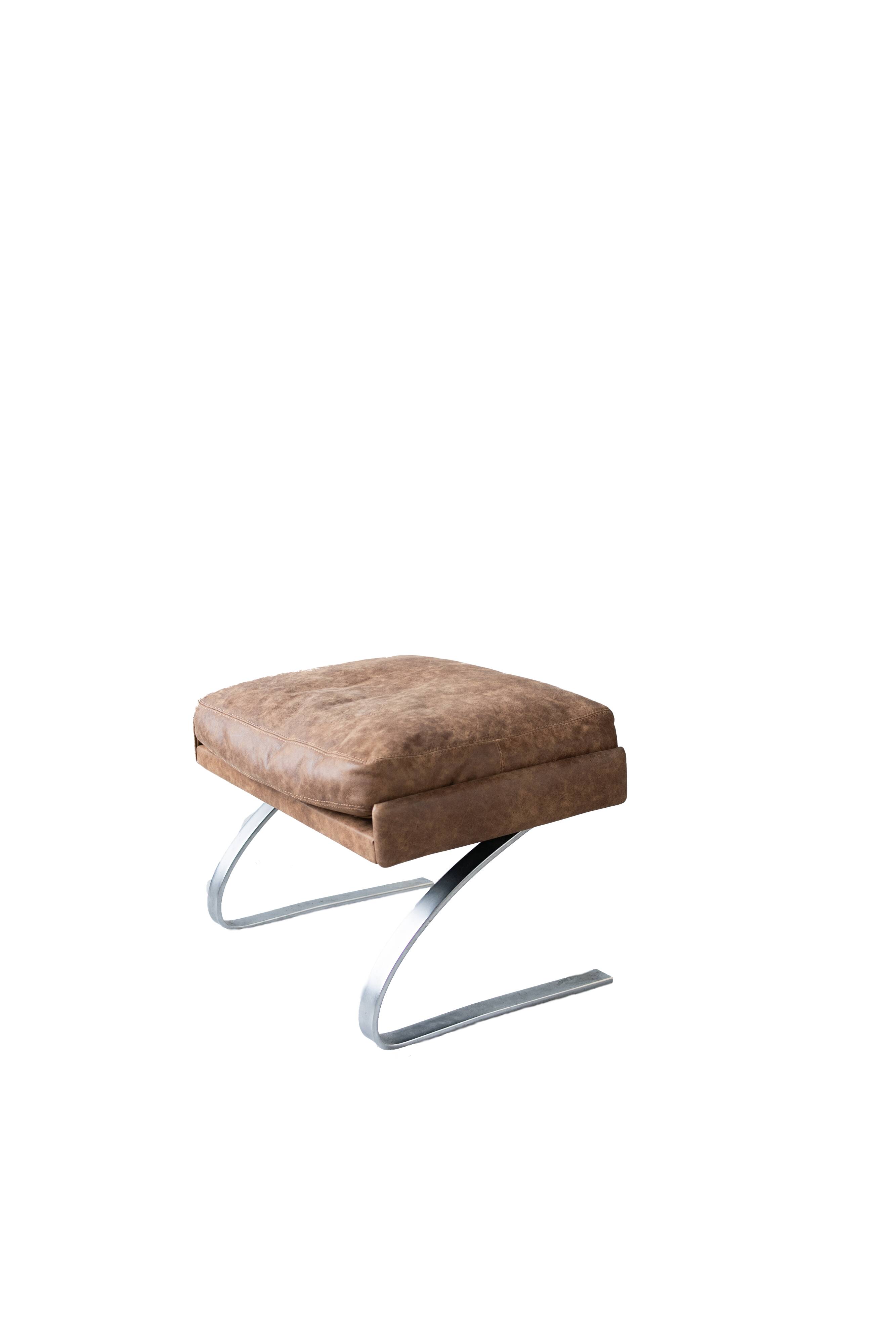 Vintage swing armchair and stool in leather by reinhold adolf for cor, 1970s, set of 2