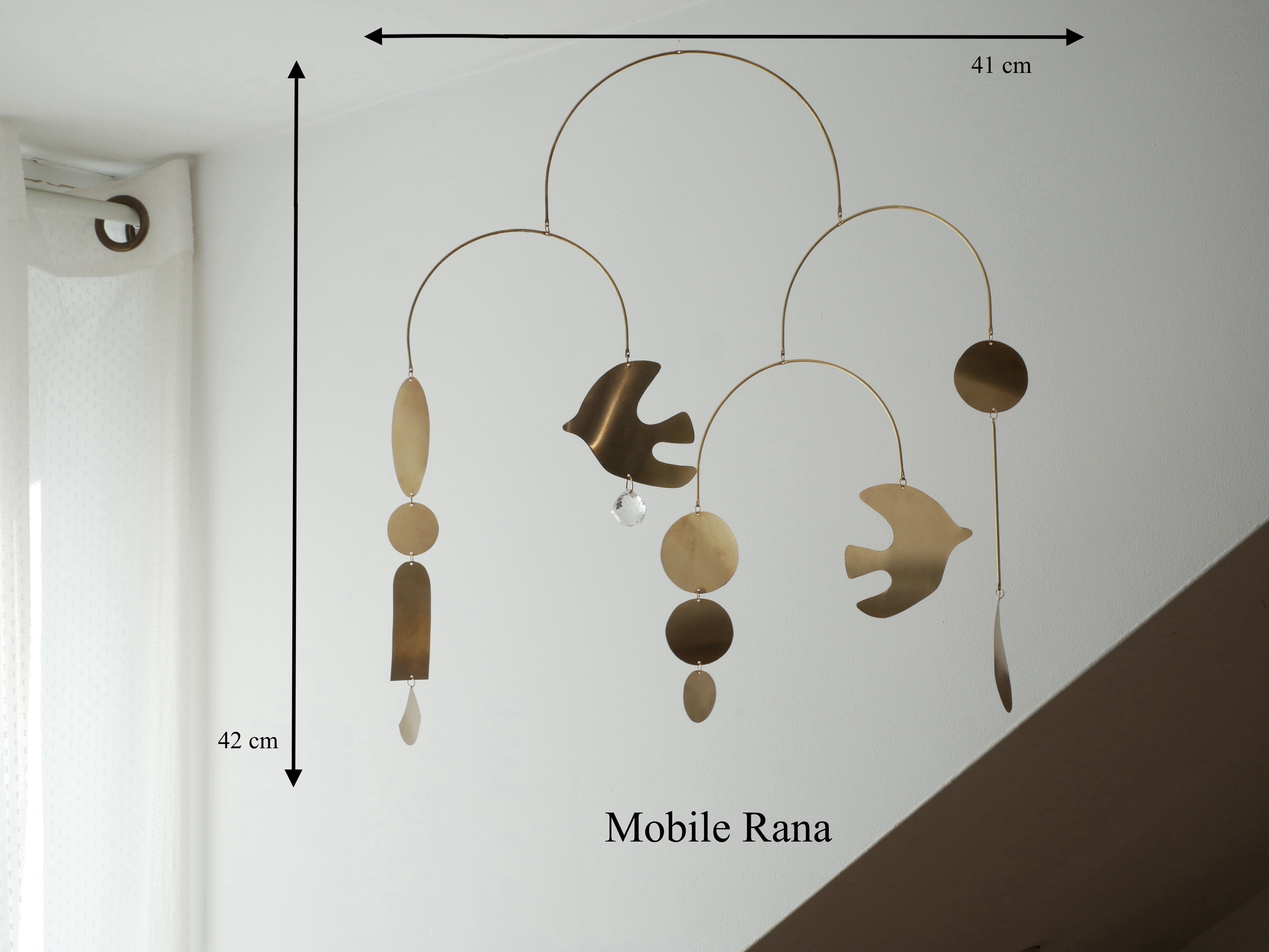 Mobile model Rana . Mobile in abstract brass.