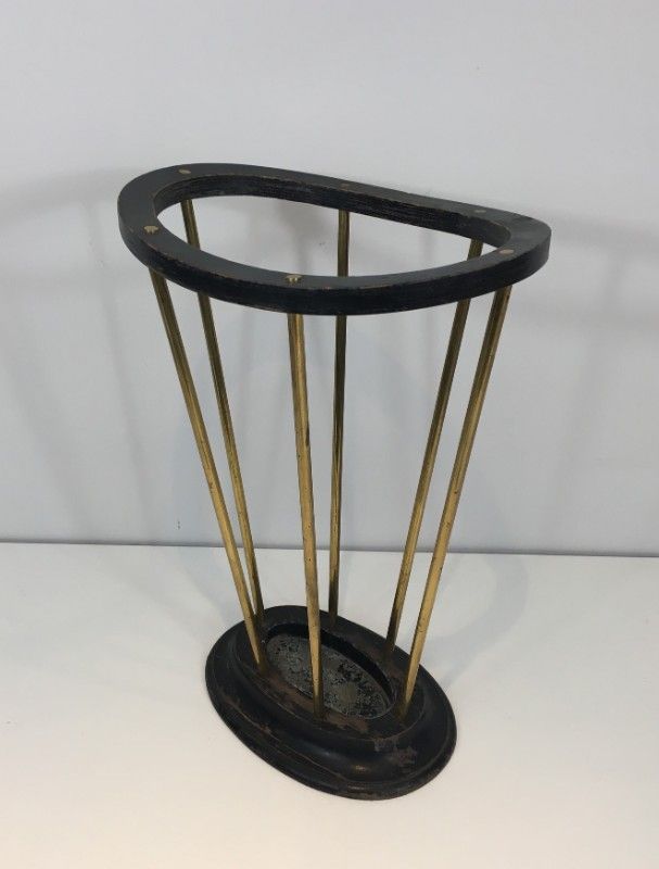Umbrella stand in blackened wood and brass. Attributed to Jacques Adnet