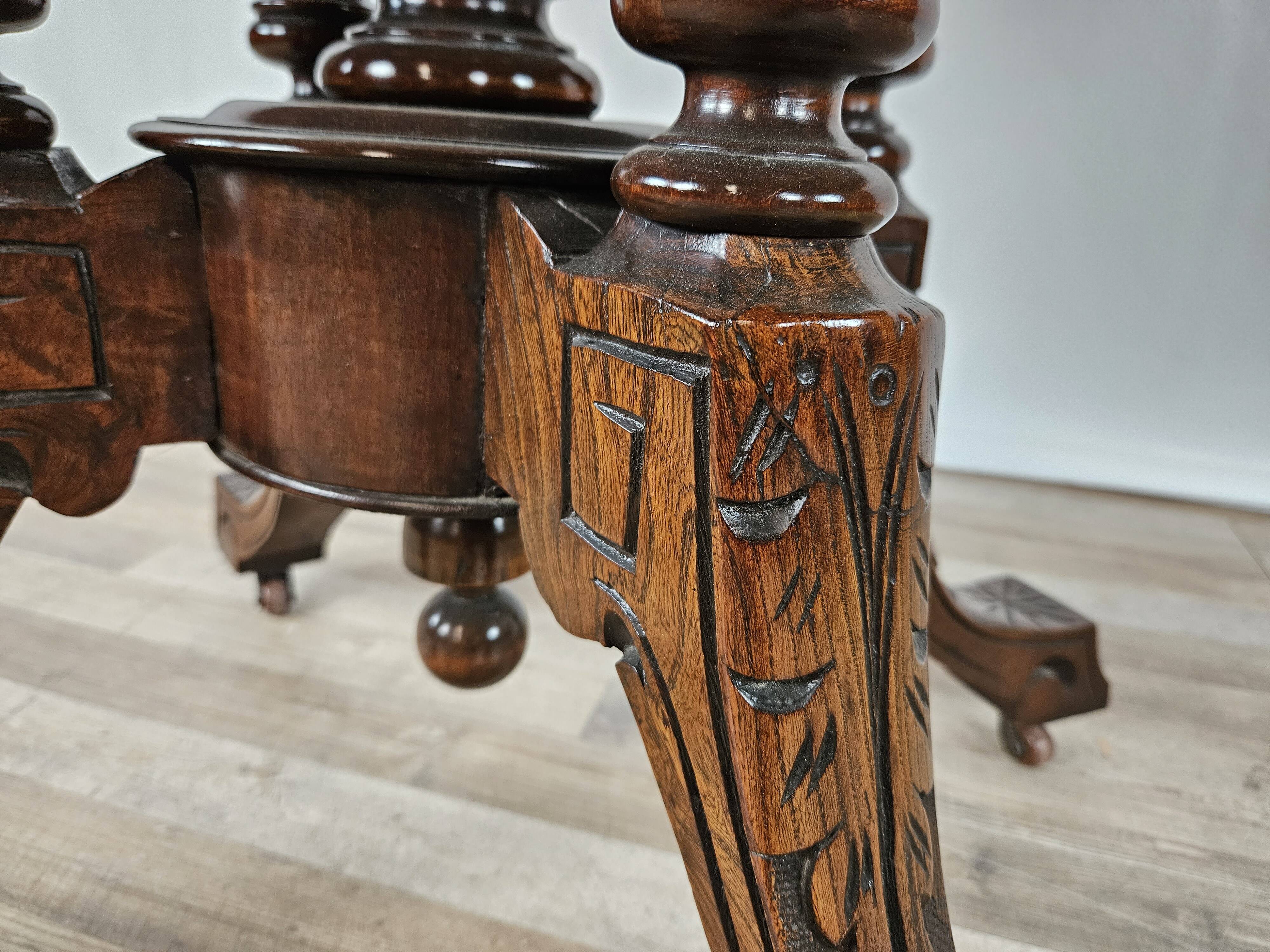 Coffee table in walnut with maple inlays and wheels