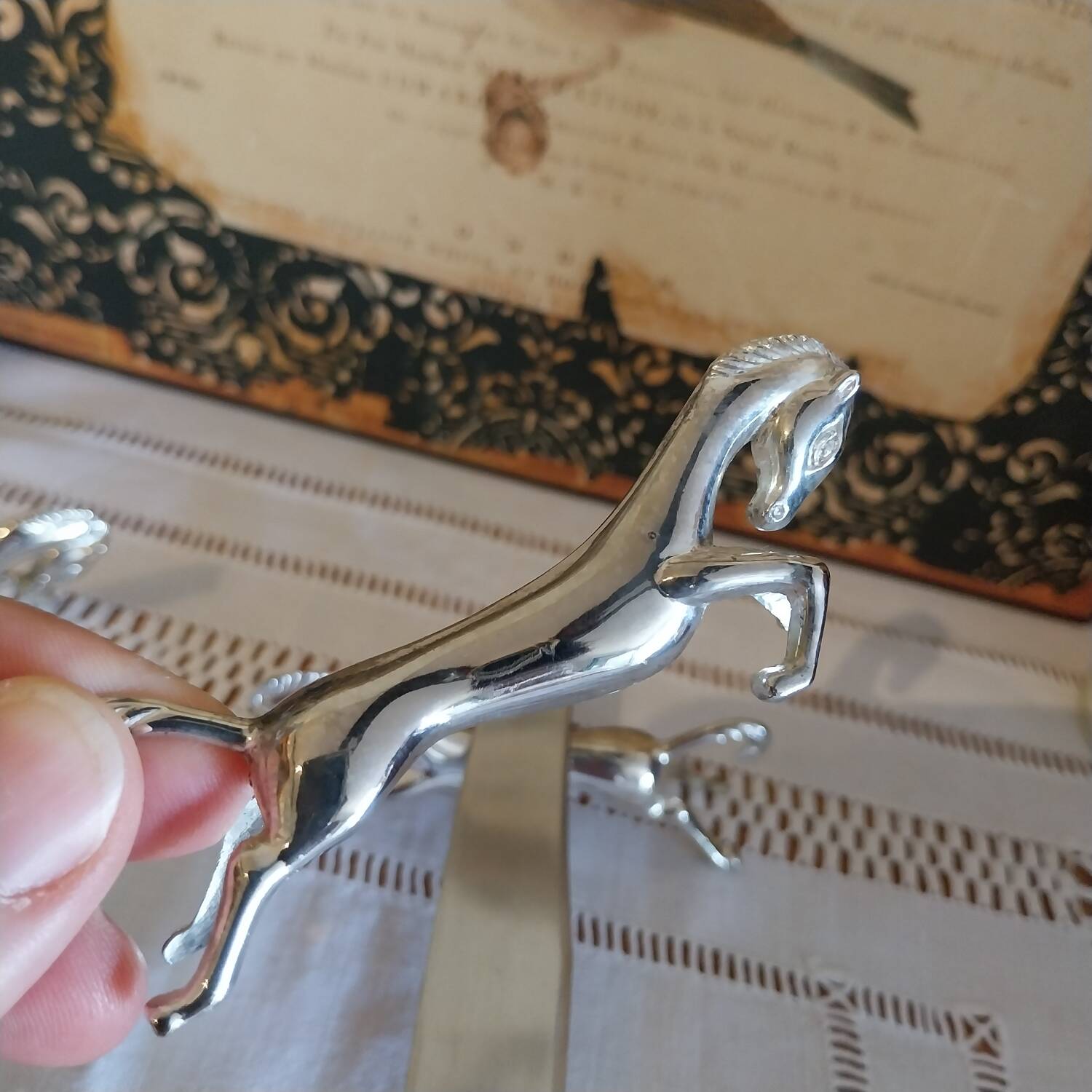 Silver metal horse-shaped knife rests