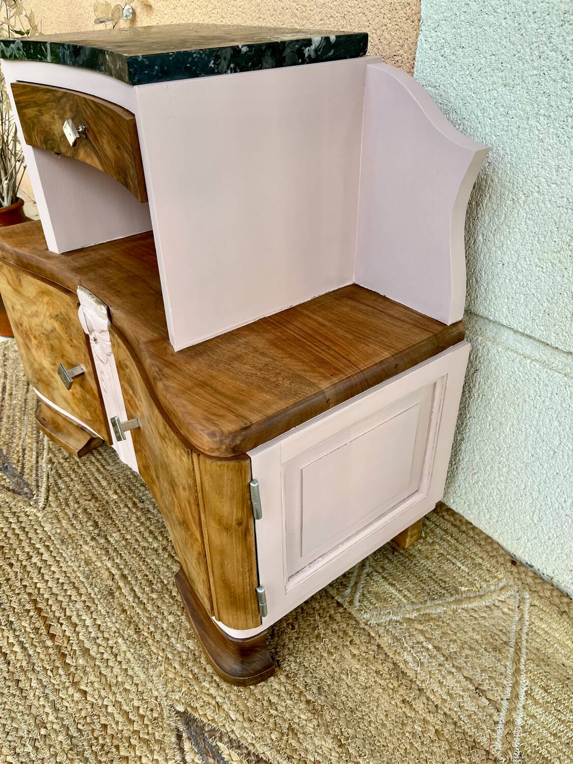 Art Deco bedside table in powder pink painted wood.
