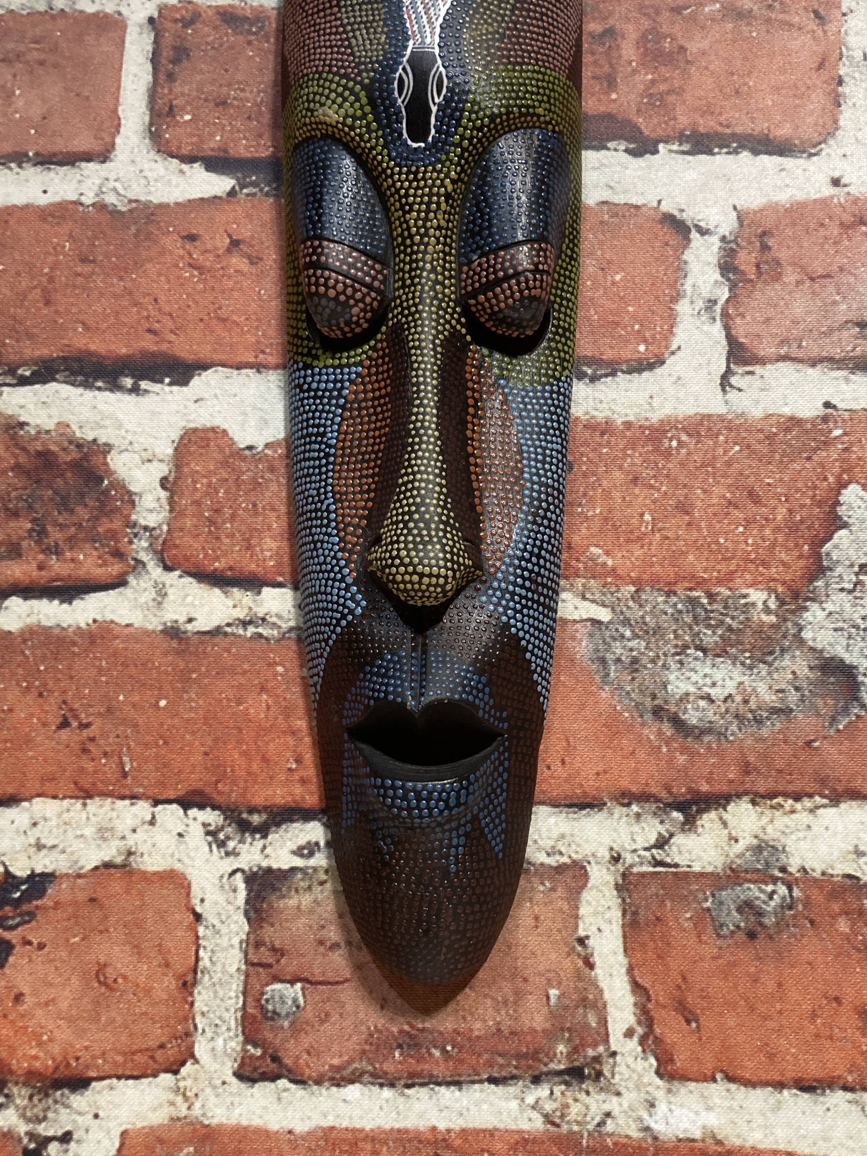 Wooden wall mask.