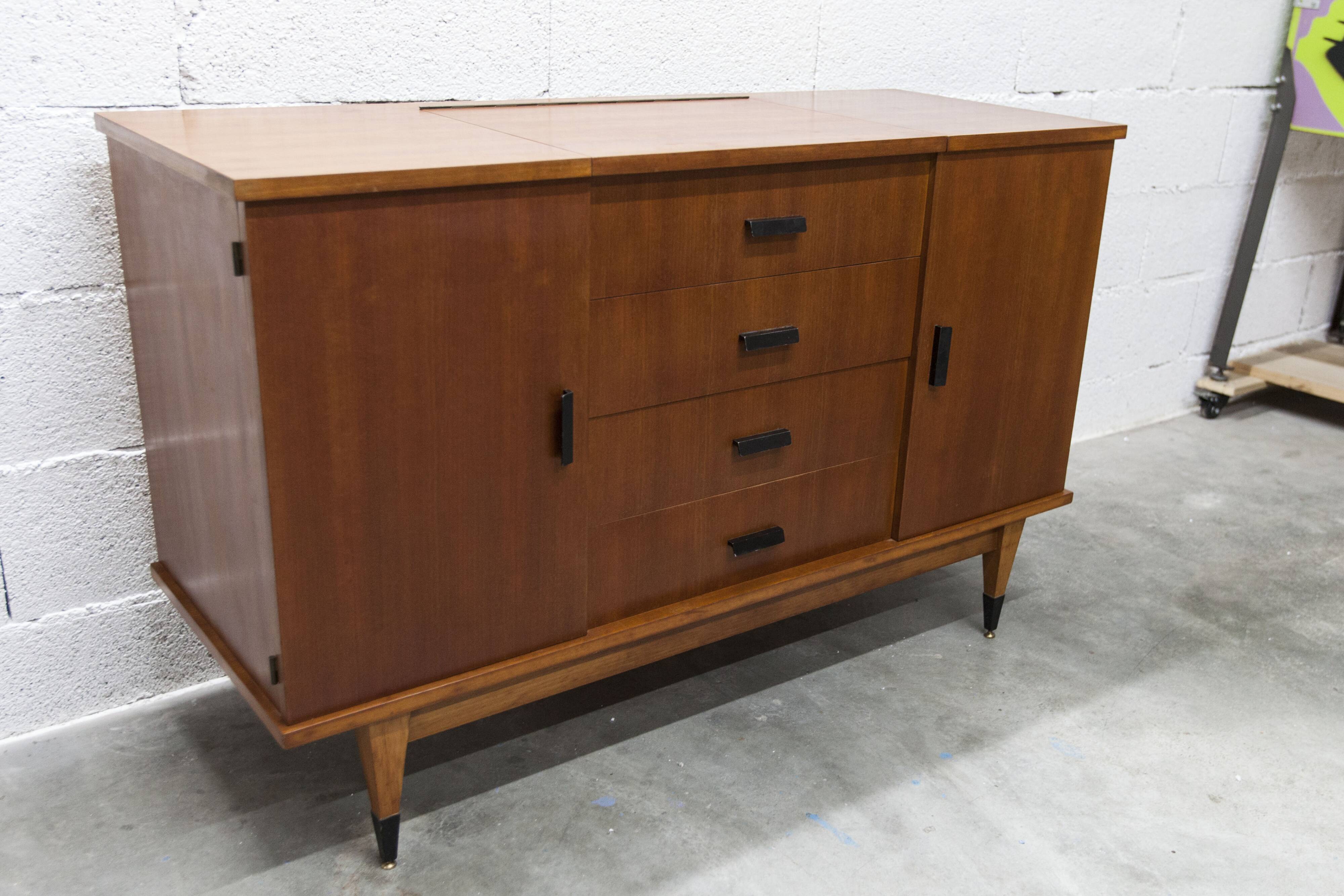 1960s teak sideboard with 4 drawers, 2 doors, and a mirror.