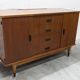 1960s teak sideboard with 4 drawers, 2 doors, and a mirror.