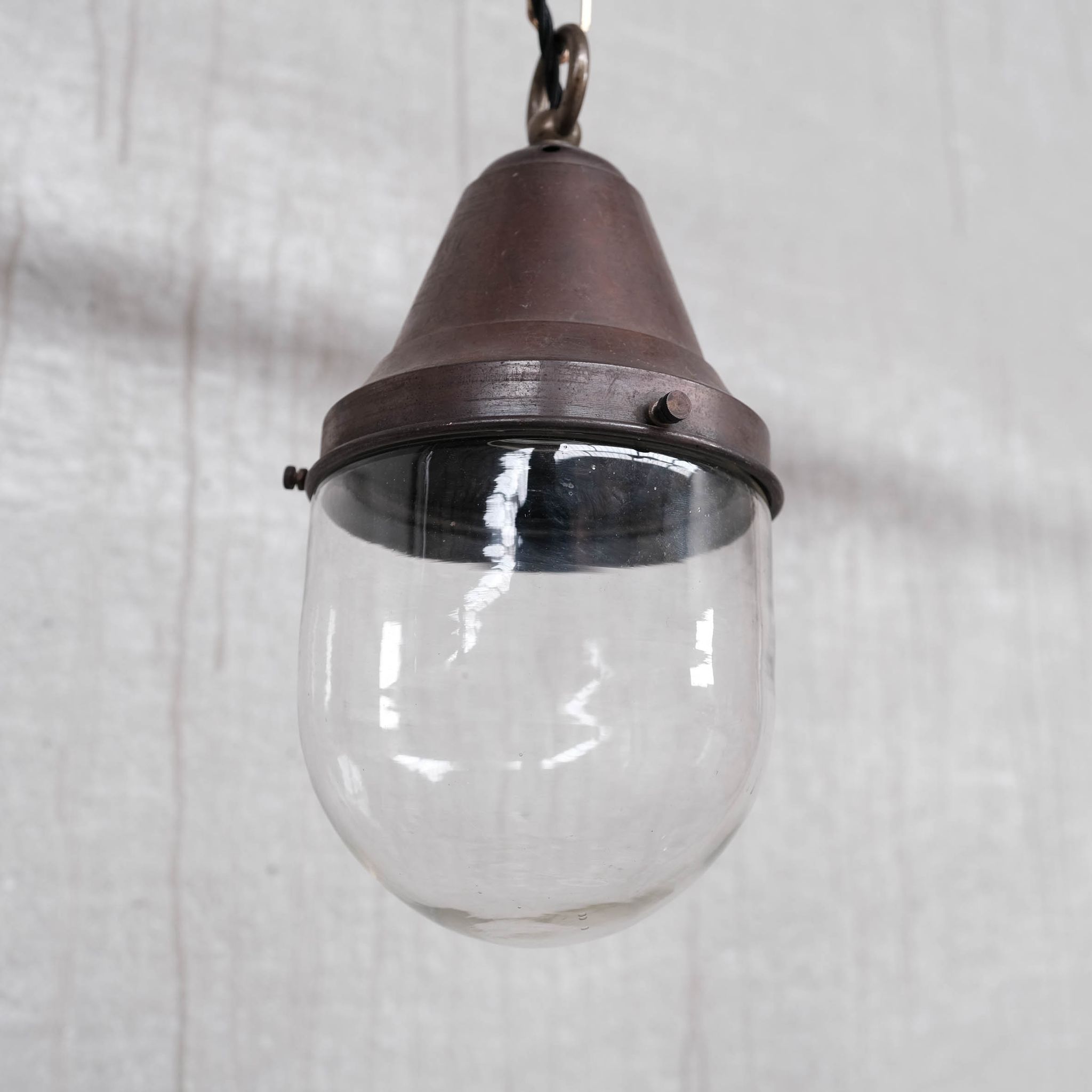 Pair of brass and clear glass industrial pendants