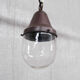 Pair of brass and clear glass industrial pendants