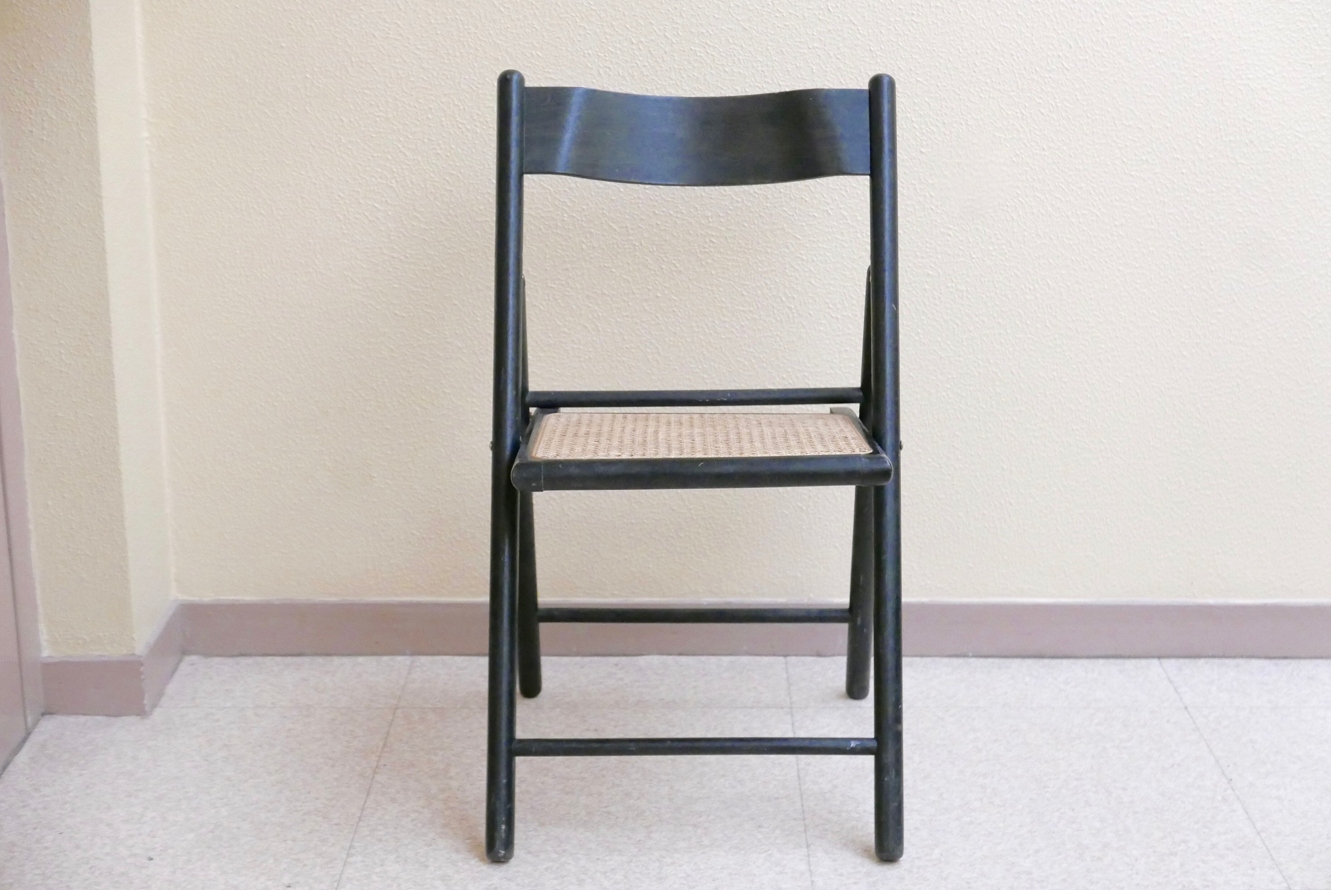 Black folding chair, 70s