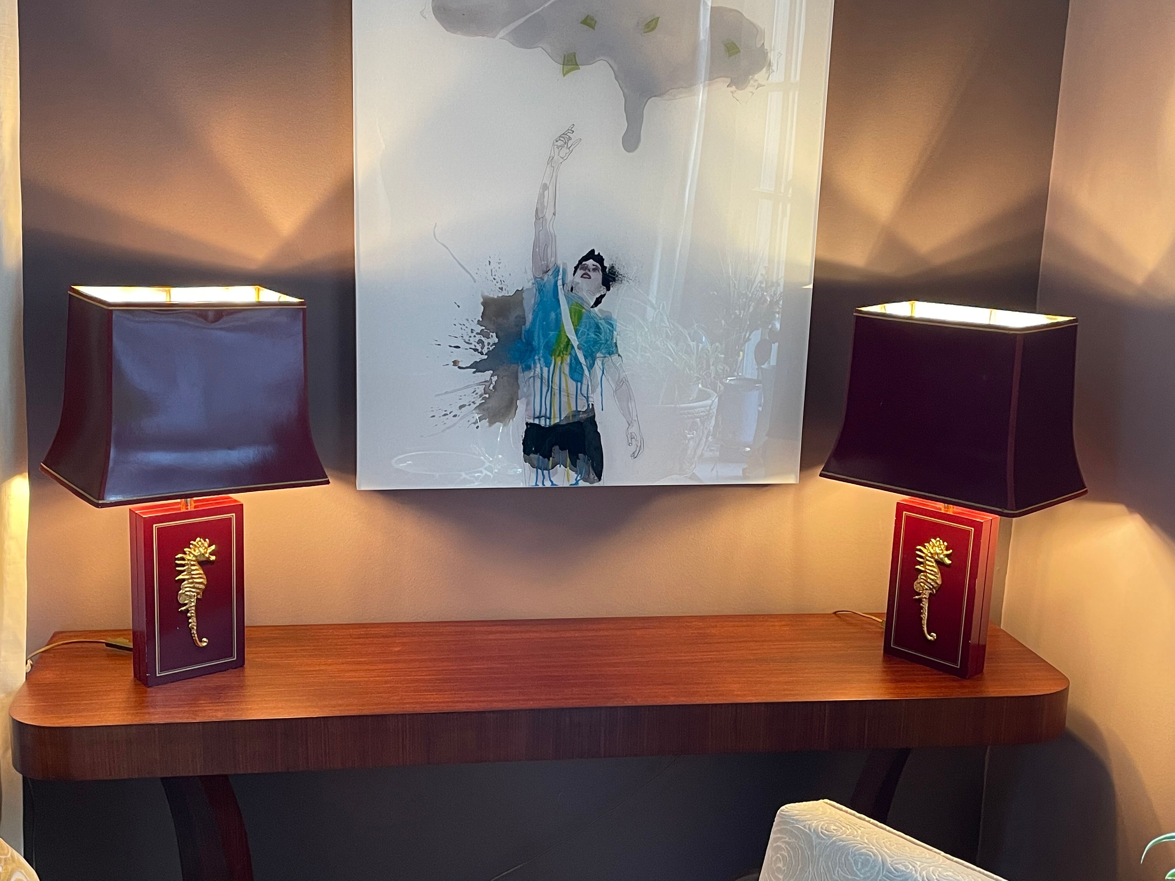 Pair of table lamps in Bordeaux lacquered wood and brass seahorse